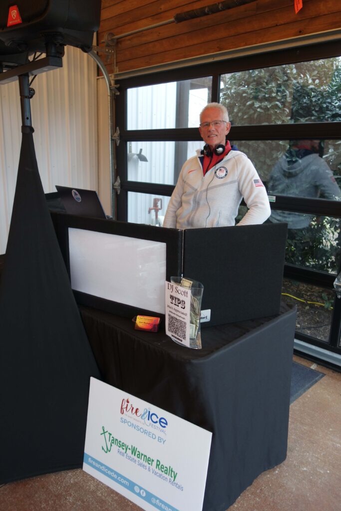 a man standing in front of a black table
