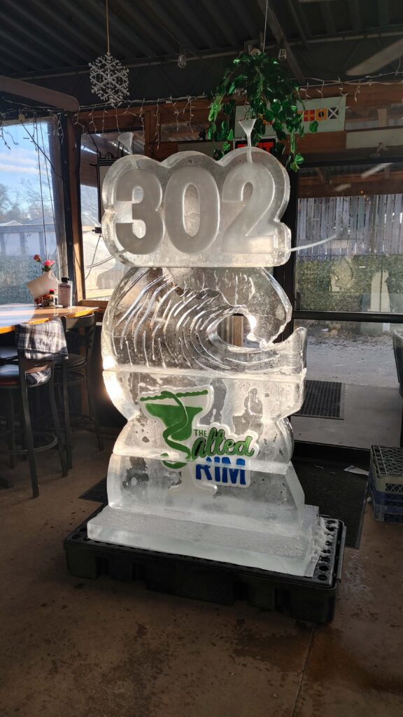 a large ice sculpture of a fish in a restaurant