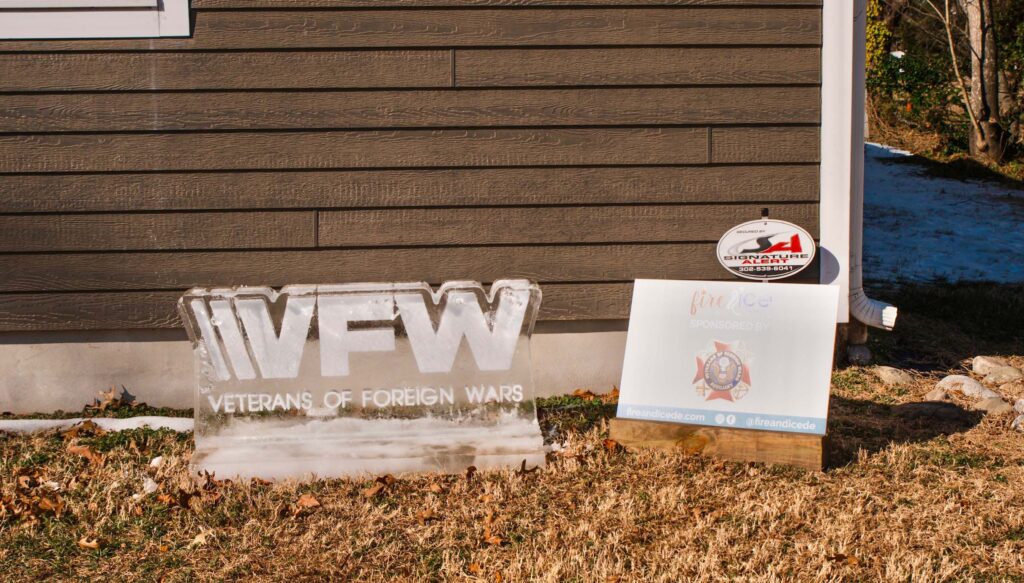 a sign in front of a house that has been vandalized