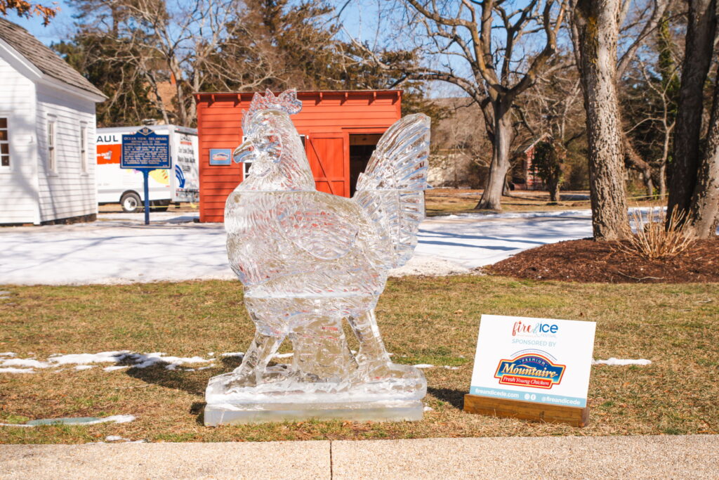an ice sculpture of a bird in front of a building