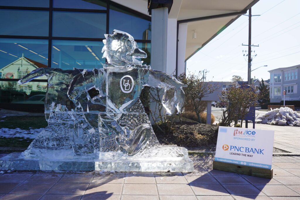 a statue of a man riding a horse in front of a building