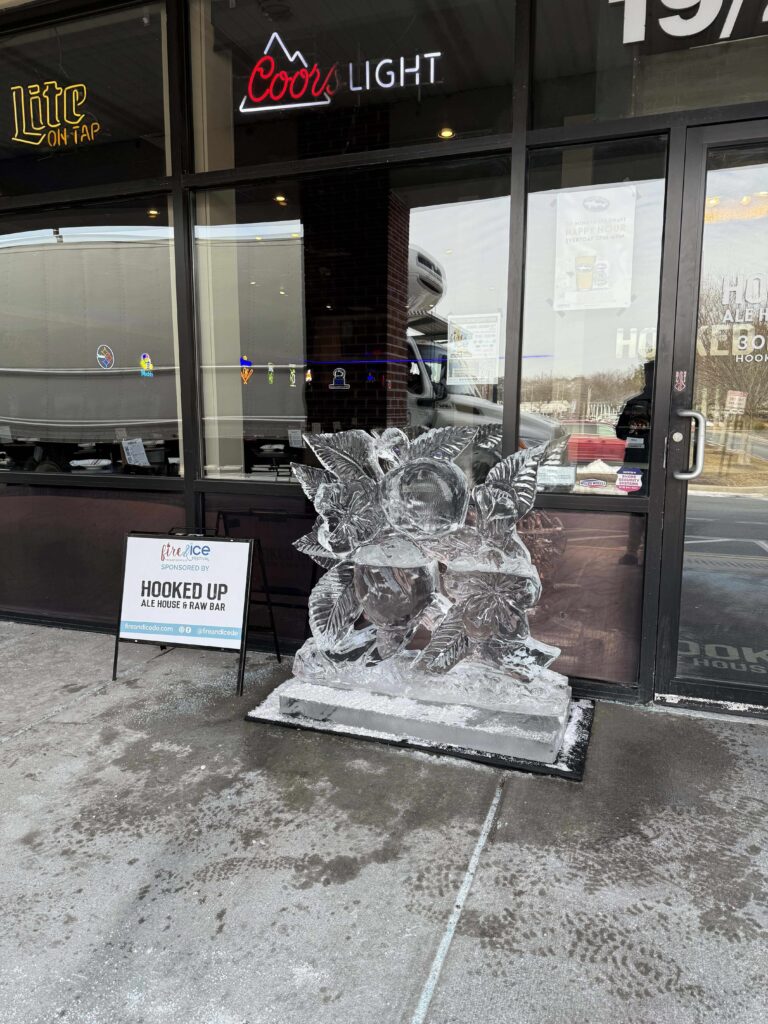 an ice sculpture is on the sidewalk outside of a store