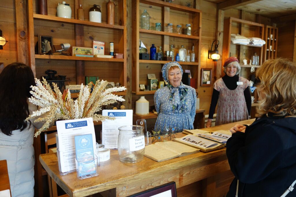 a group of people standing around a counter