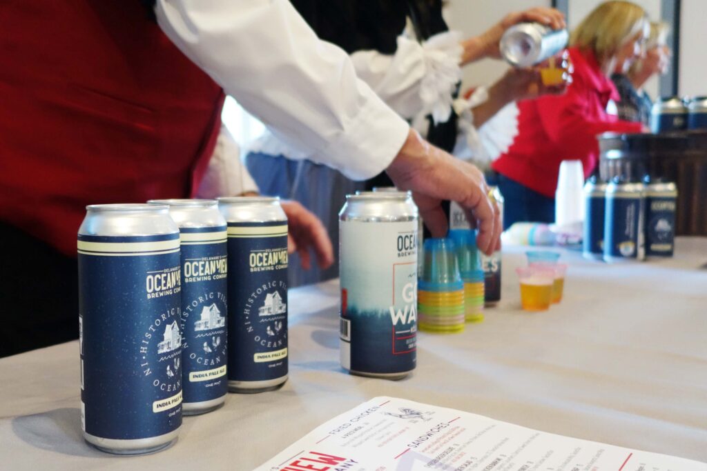 a man pouring a can of beer into a can