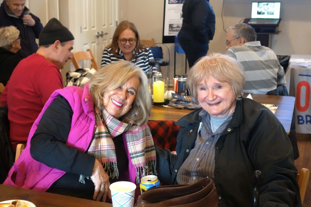 a couple of women sitting at a table