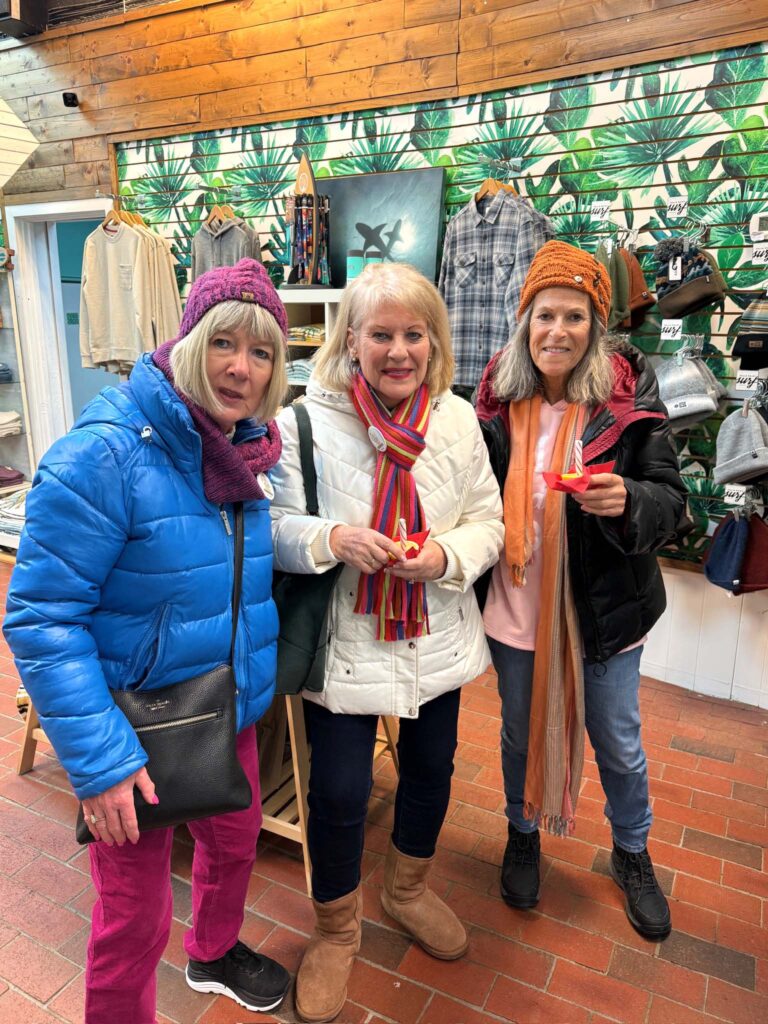 a group of women standing next to each other