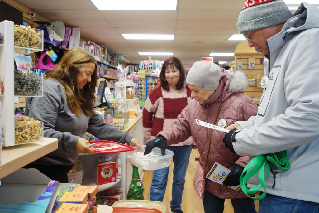 a group of people shopping in a store