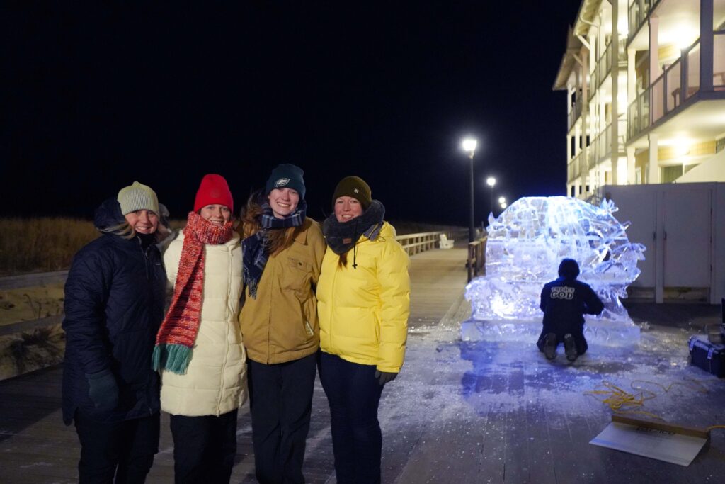 a group of people standing next to each other in front of a building