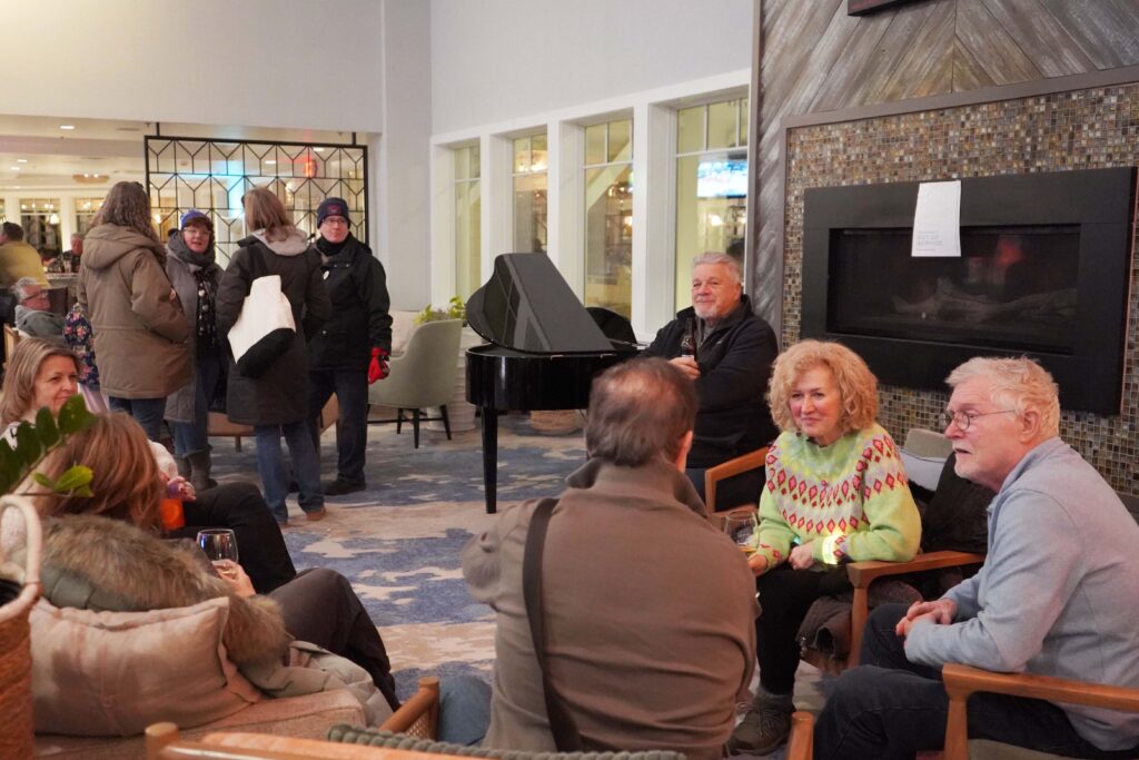 a group of people sitting around a living room