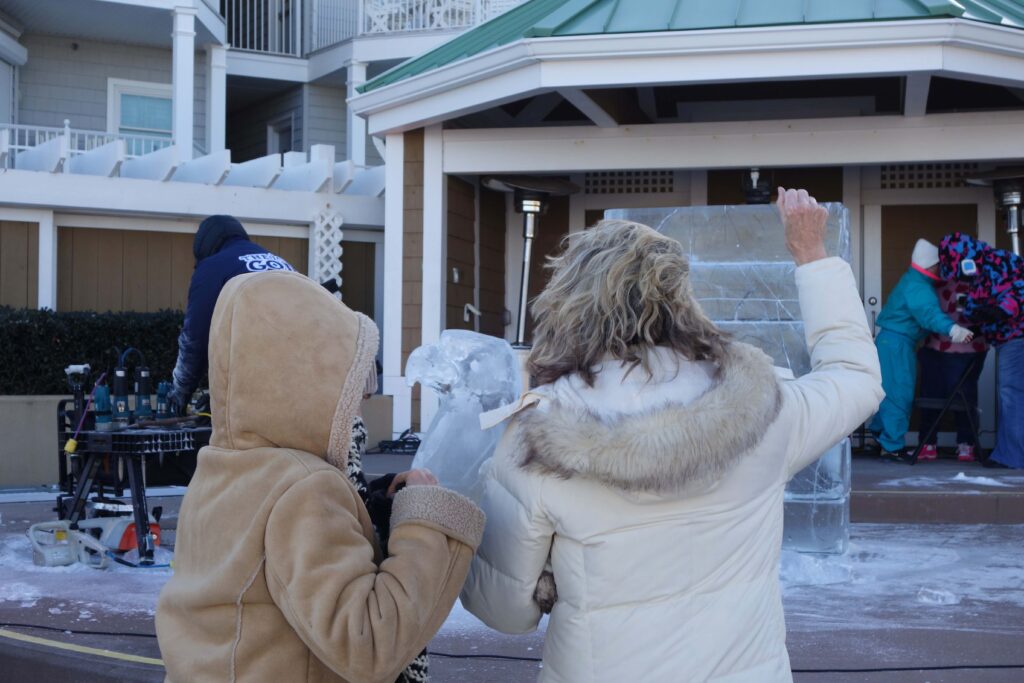 a couple of people standing in front of a building