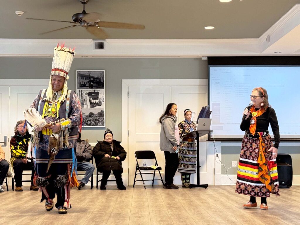 a group of people standing on top of a hard wood floor