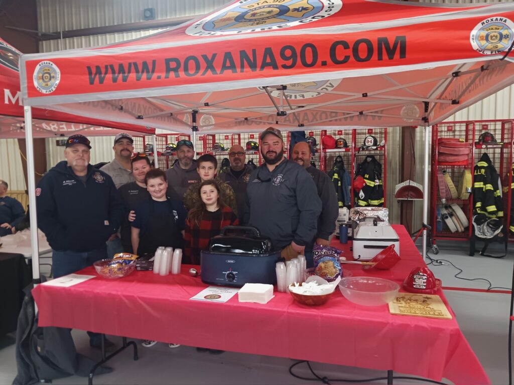 a group of people standing under a tent