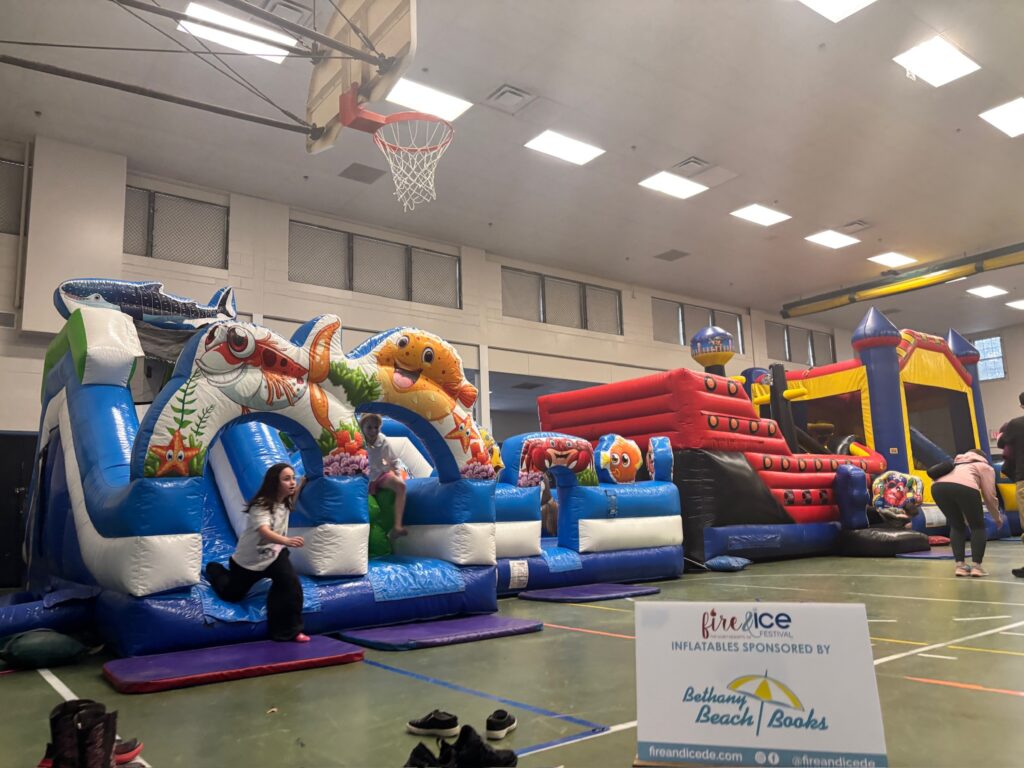 a large inflatable bounce house with a basketball hoop