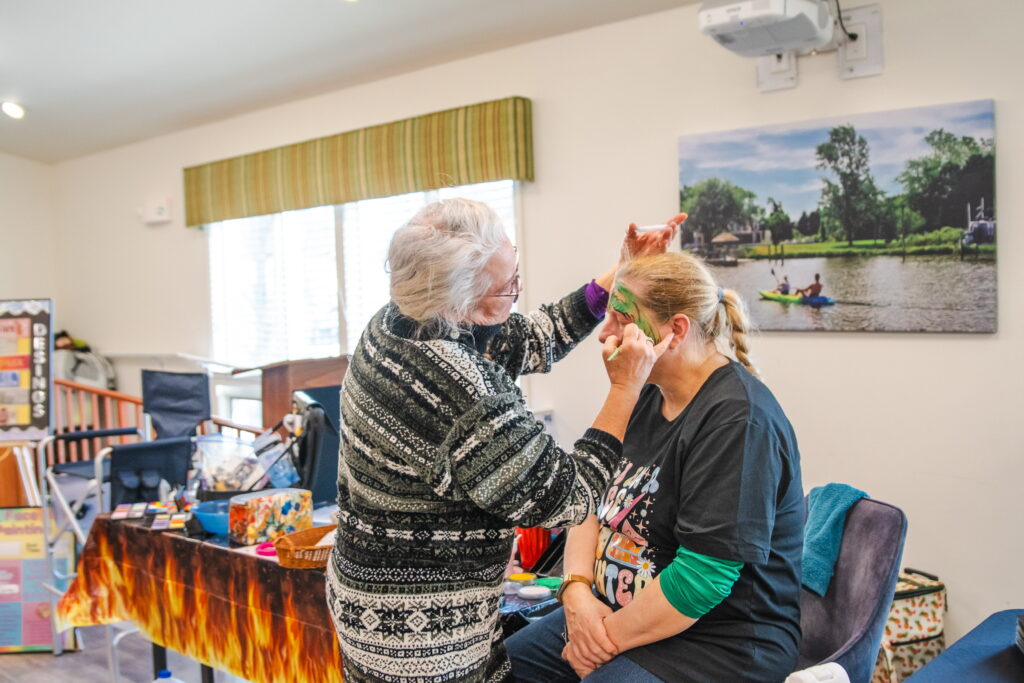 a woman getting her hair cut in a salon