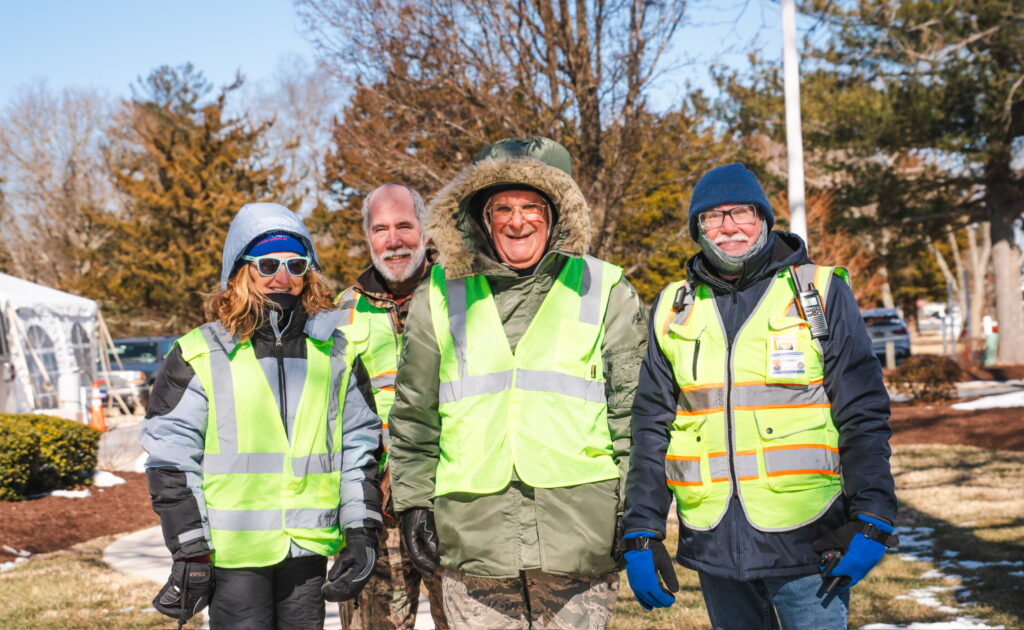 a group of people standing next to each other