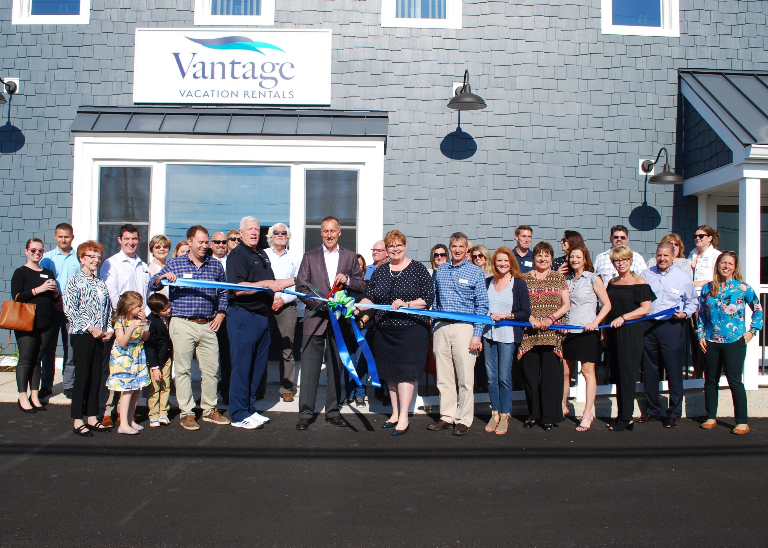 people cutting ribbon