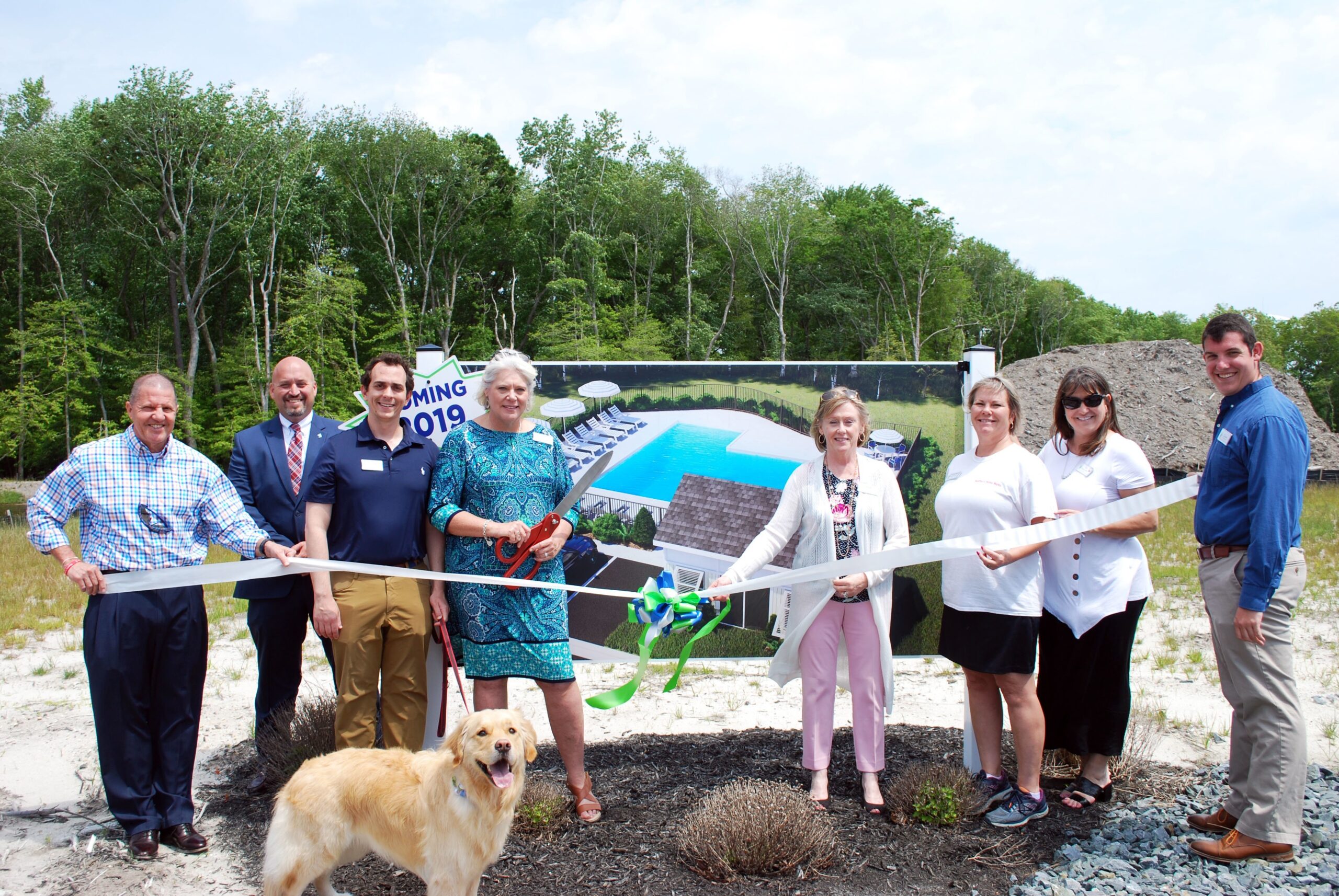 cutting ribbon to pool