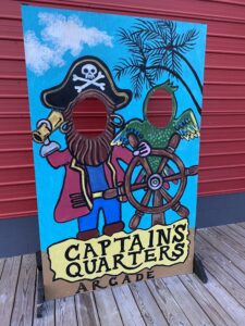 a painting of a pirate with a parrot on his shoulder