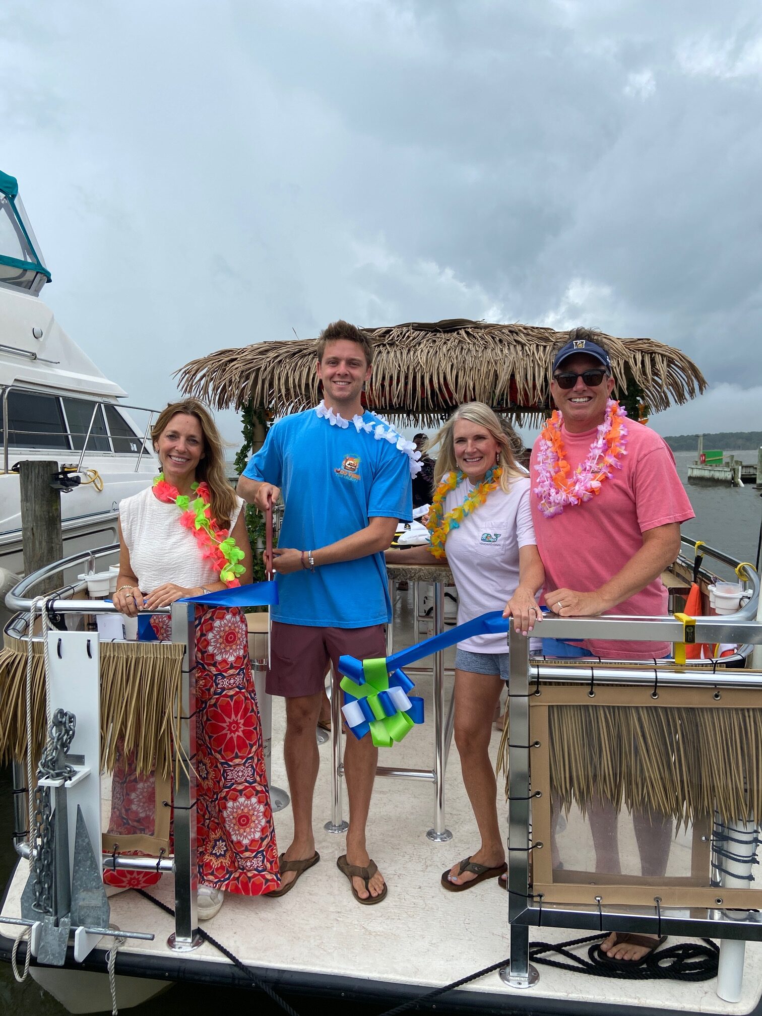 a group of people standing on the back of a boat