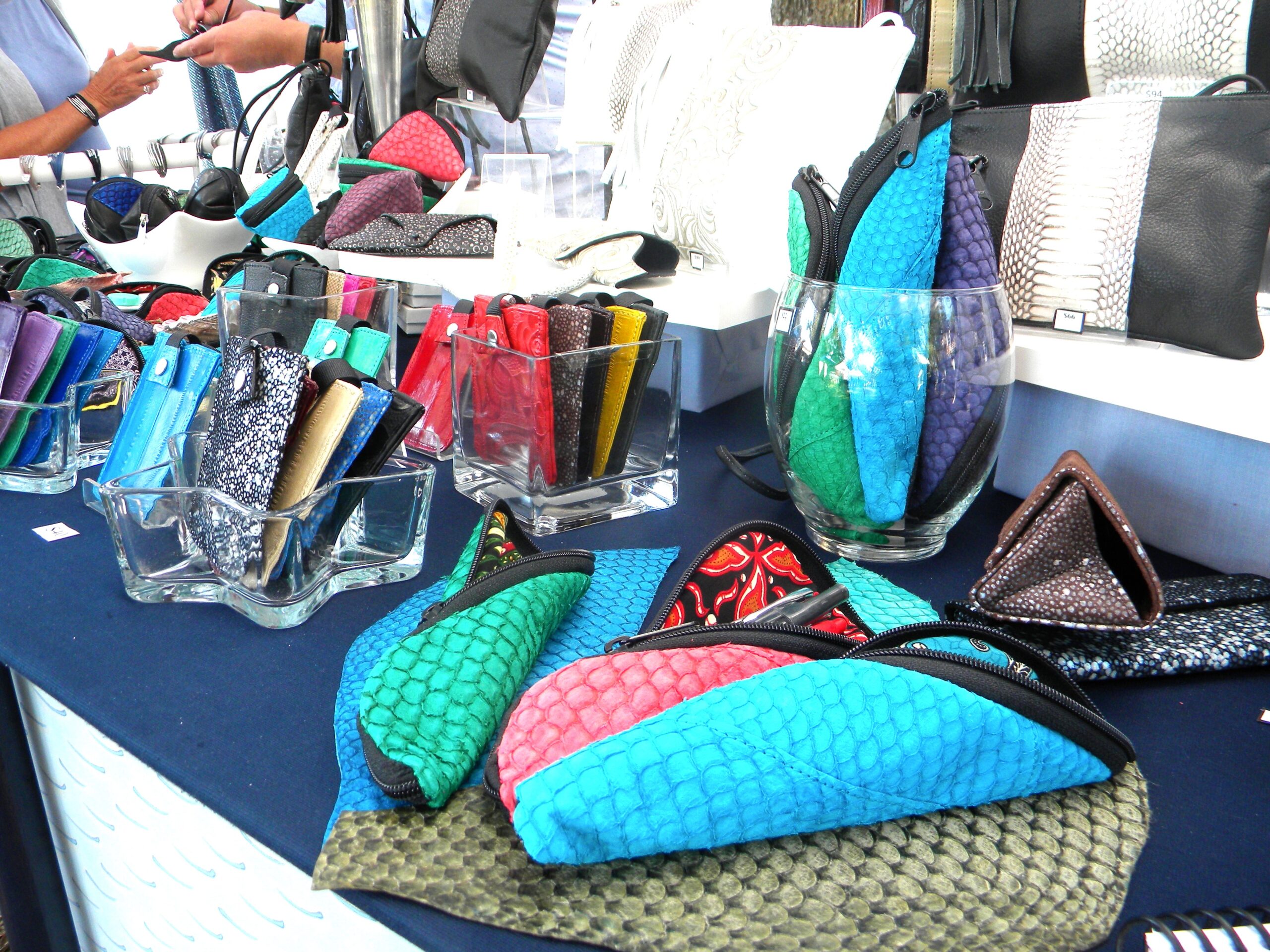 a table that has a bunch of purses on it