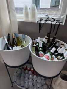 a couple of buckets filled with bottles of beer