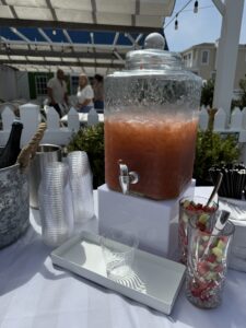 a table topped with a large jar of liquid
