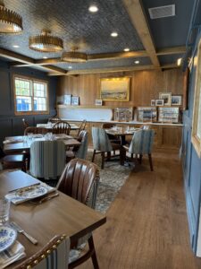 a restaurant with wooden tables and blue walls