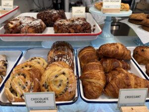 a display case filled with lots of different types of pastries