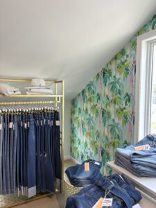 a closet filled with lots of blue jeans