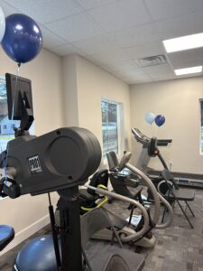 a room filled with balloons and a gym equipment