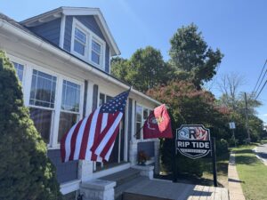 a house with a flag on the front porch