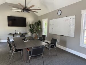 a conference room with a large table and chairs