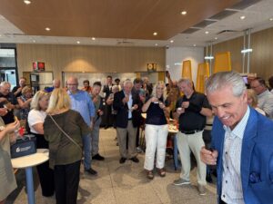 a group of people standing in a room