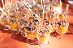 a table topped with lots of glasses filled with drinks