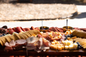 a platter of meats and cheeses on a table