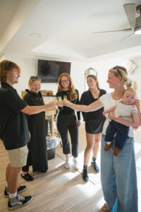 a group of people standing around each other
