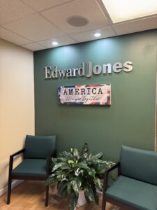 a waiting room with chairs and a plant