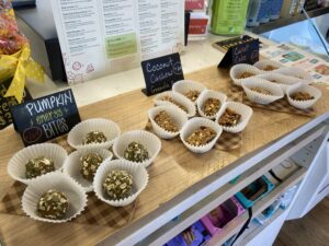 a counter with several cups of food on it