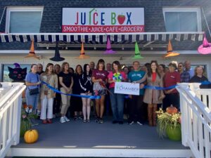 a group of people standing outside of a house