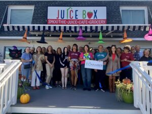 a group of people standing outside of a house