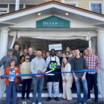 a group of people standing in front of a building