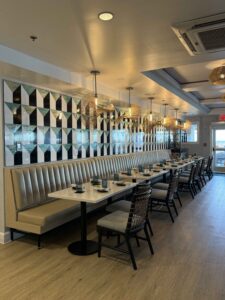 a restaurant with a long table and chairs
