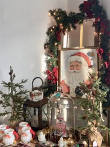 a christmas display with a picture of a santa clause