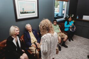 a group of women sitting in a room