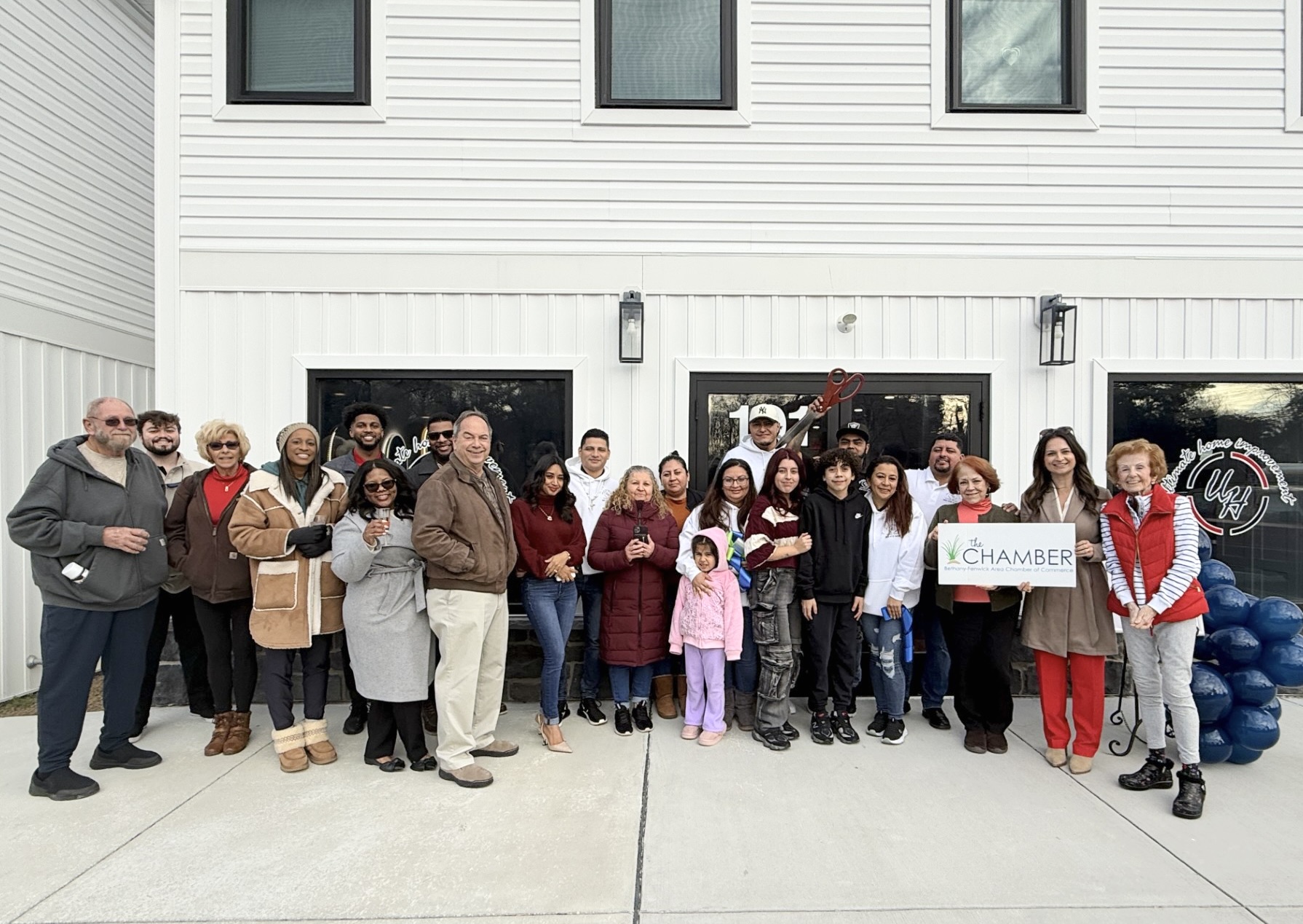 a group of people standing in front of a building
