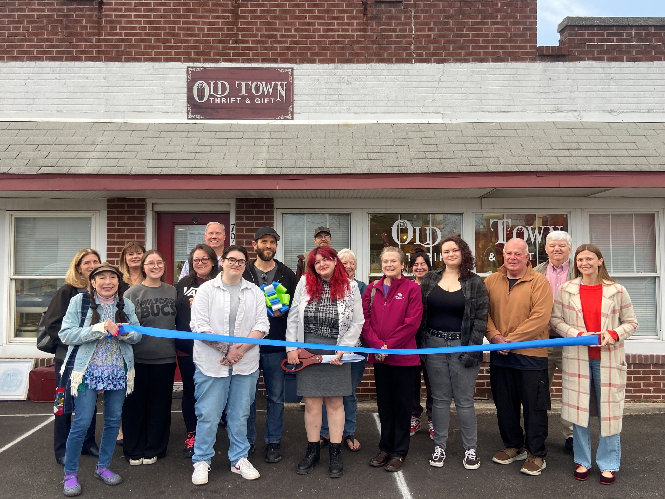 a group of people standing in front of a building