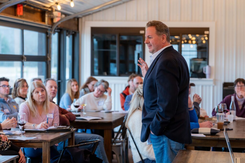 a man standing in front of a group of people
