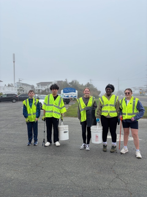 a group of people standing in a parking lot