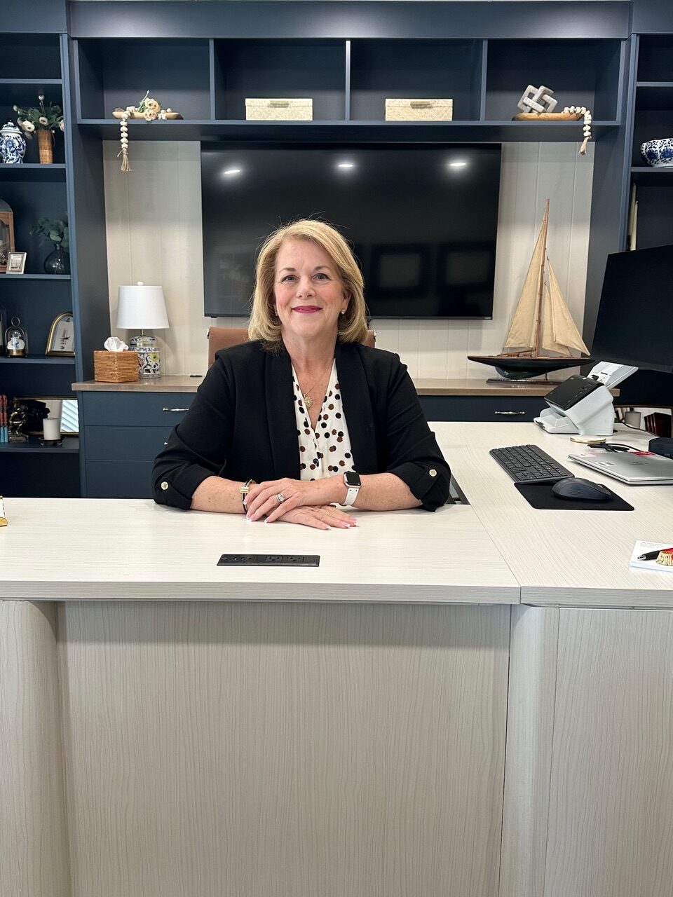 a woman is standing in a room with shelves