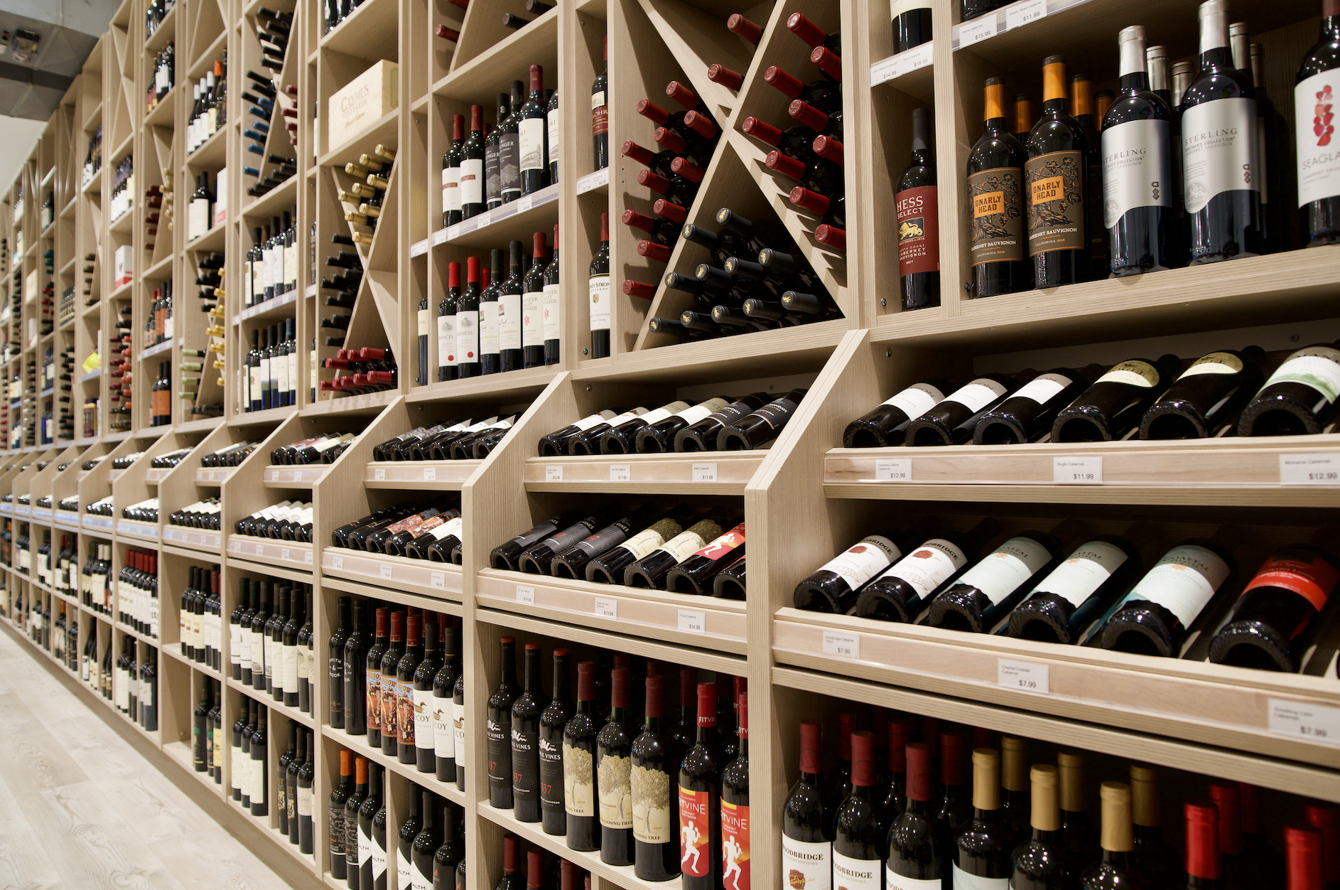 a wine rack filled with lots of bottles